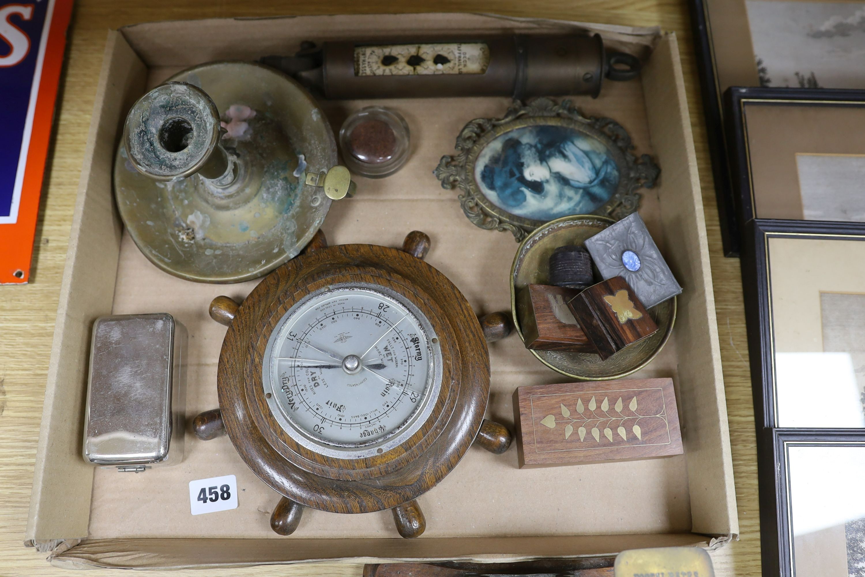 A box of curios including ship's log, brass projectile arrow and postal scales